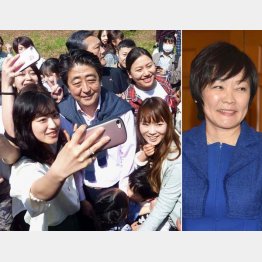 花見客と写真撮影する安倍首相、右は昭恵夫人（Ｃ）共同通信社